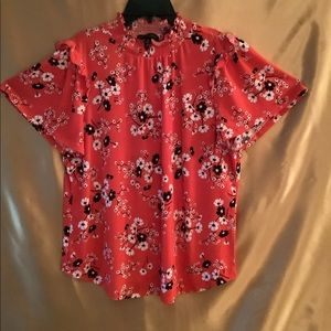 Woman’s flutter sleeve blouse